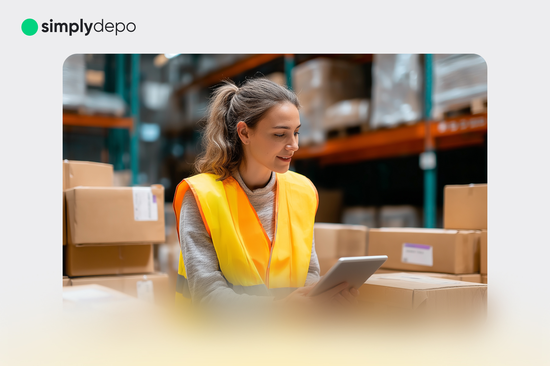 A woman in a yellow safety vest uses a tablet to check stock among cardboard boxes in a warehouse. SimplyDepo logo top left.