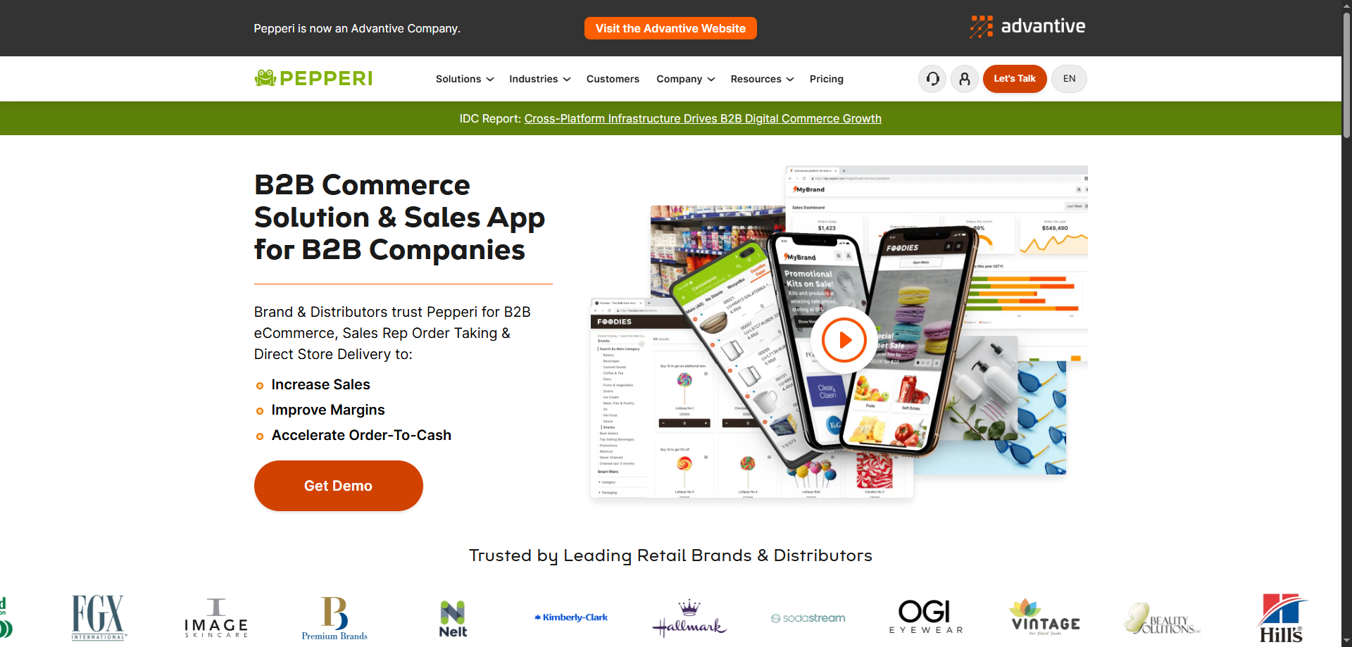 Pepperi website homepage showcasing B2B commerce solutions, sales app on phones, Get Demo button, and top food distribution brand logos.