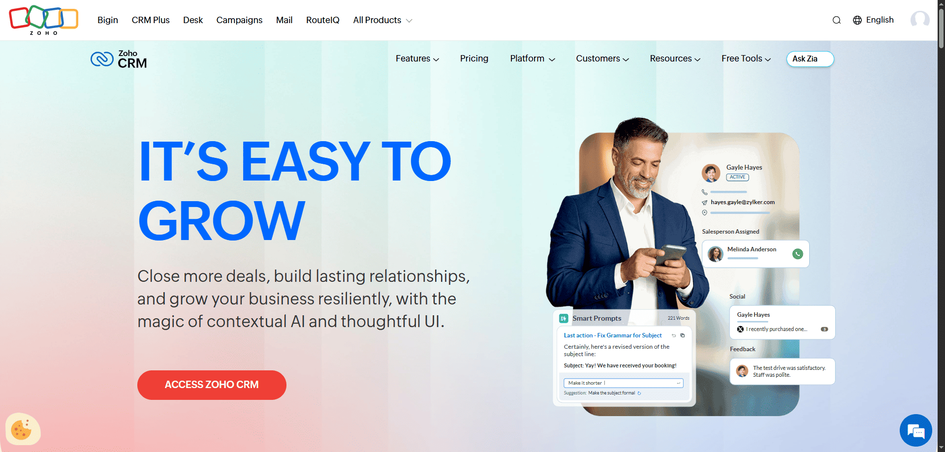 Zoho CRM homepage screenshot with a suited man on phone, “It’s easy to grow” headline, key CRM features, and “Access Zoho CRM” button.