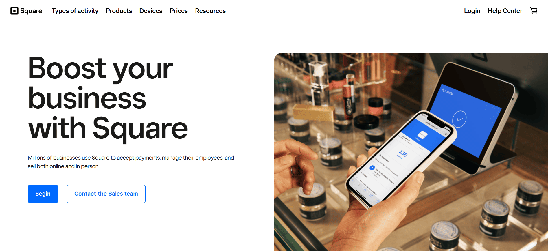 A person uses a smartphone with the Square app beside a payment terminal and beauty products. Text: Boost your business with Square.