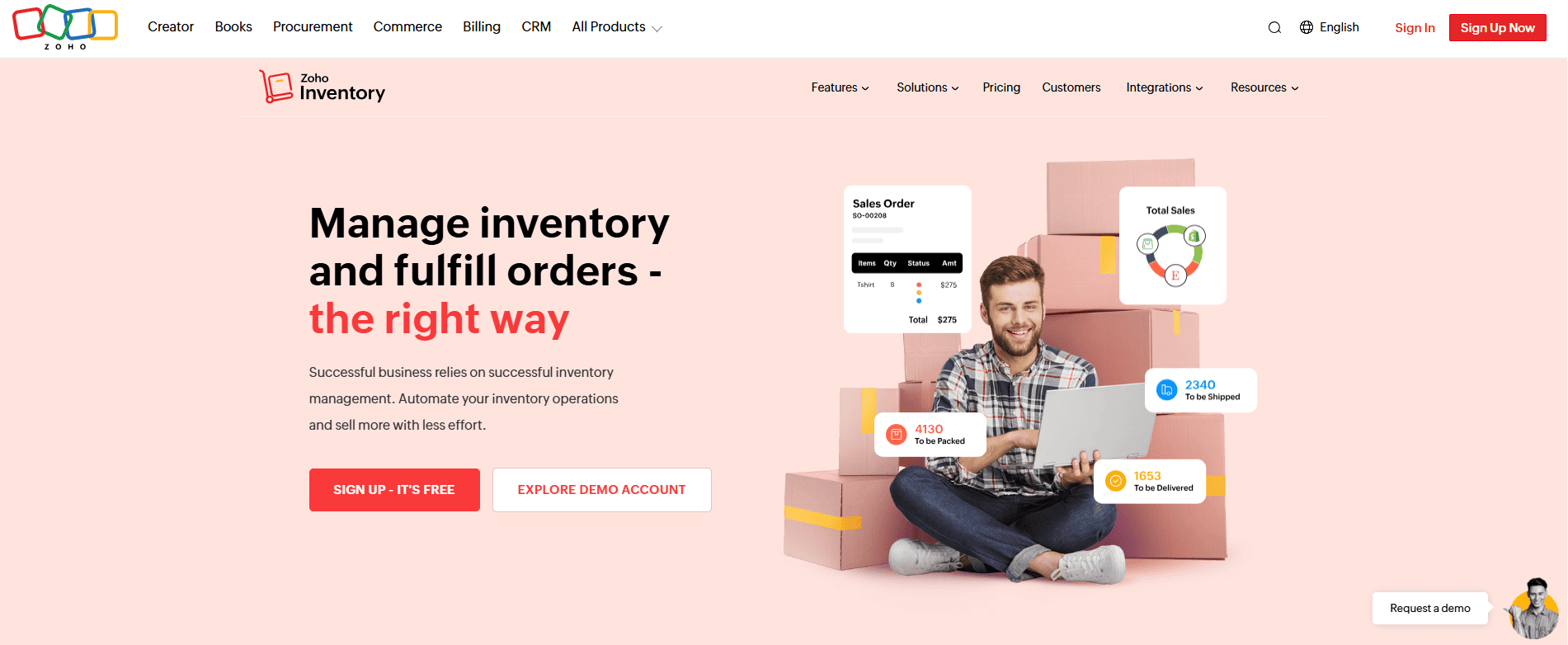 A man works on a laptop atop pink boxes, with vibrant inventory icons around him and the Zoho Inventory site showing sign-up options.