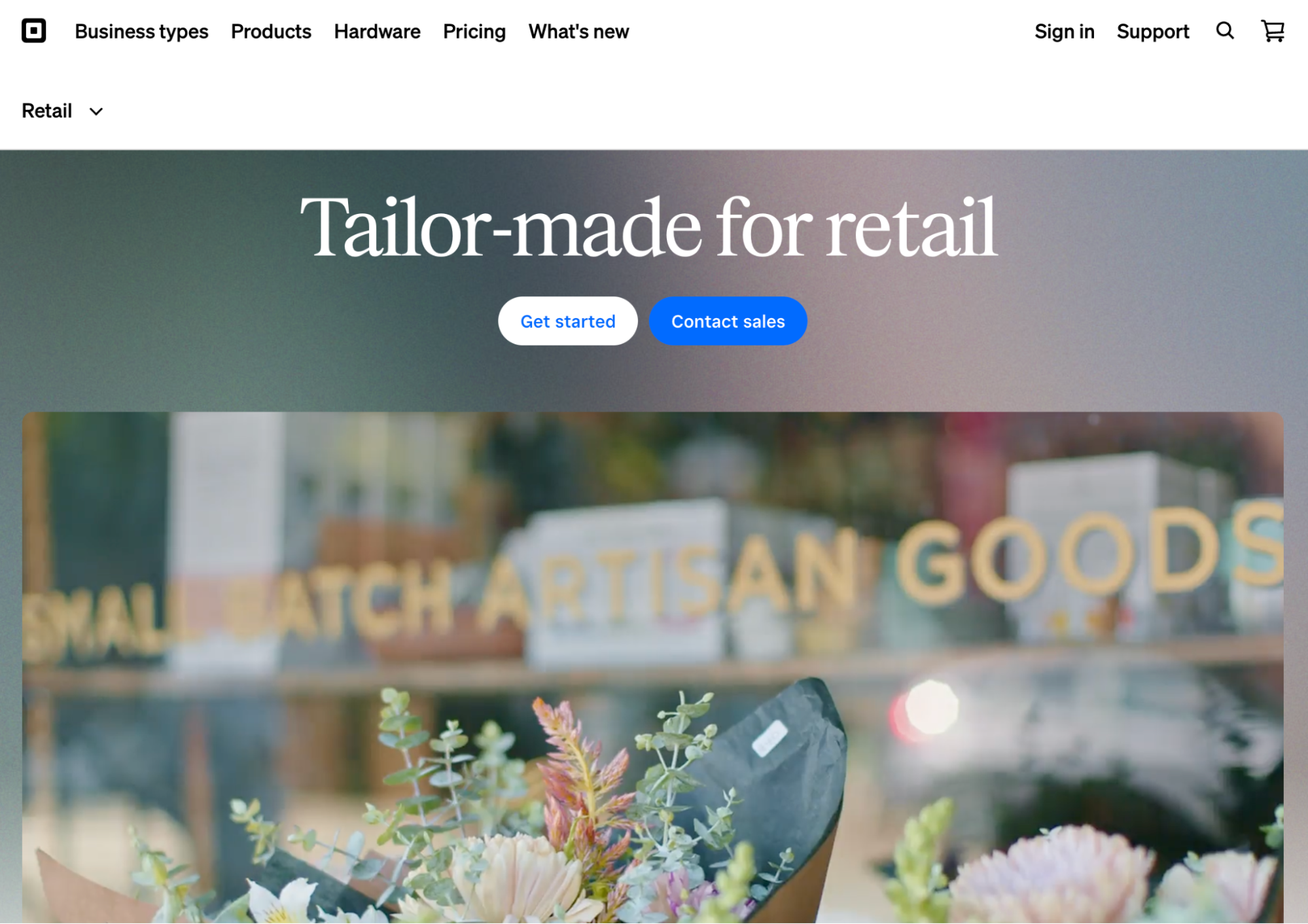 Modern small business website with 2026-style headline, Get started and Contact sales buttons, and floral shop window reading SMALL BATCH ARTISAN GOODS.