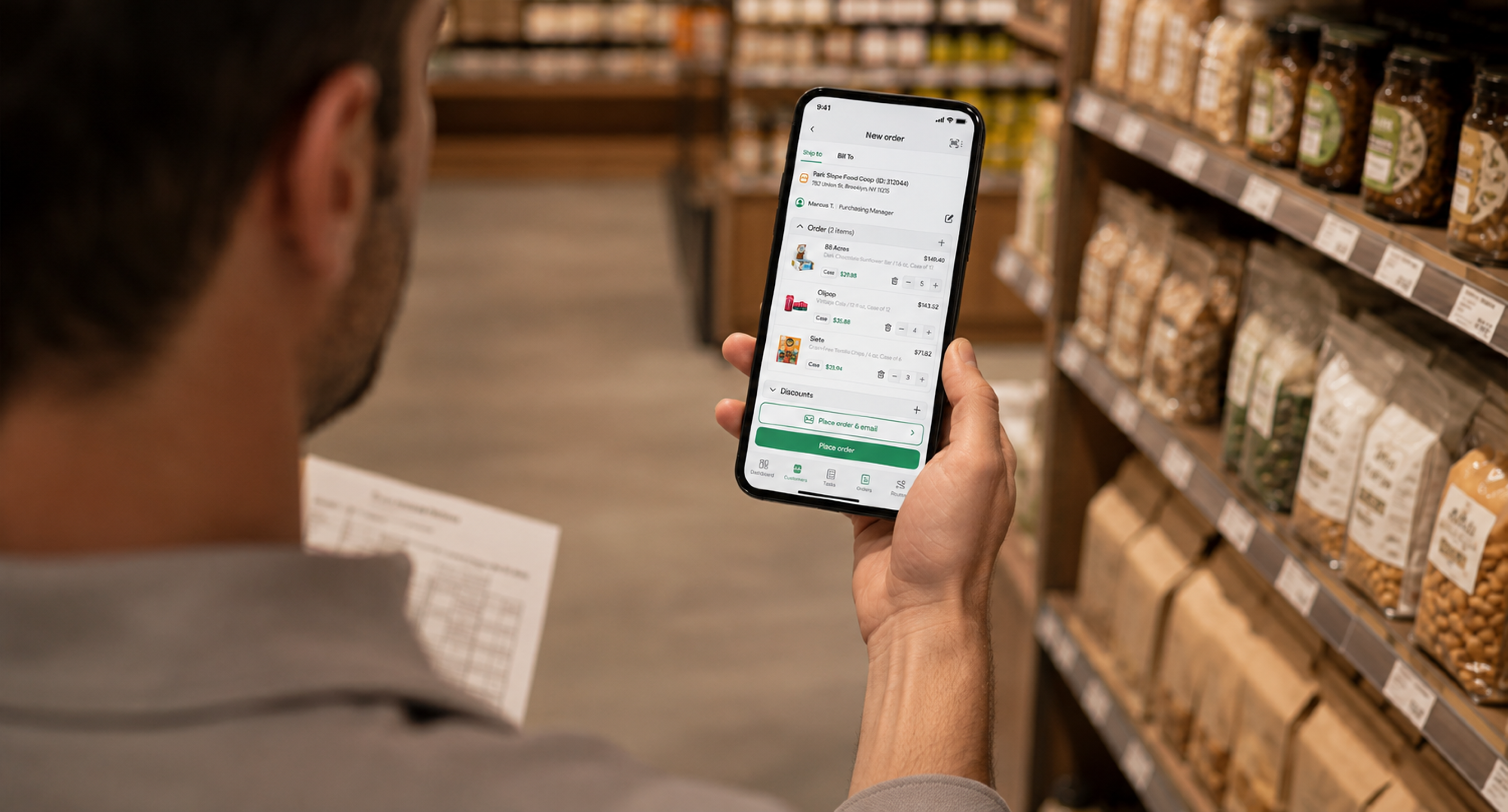 Field sales rep reviewing a customer order in the SimplyDepo mobile app while working in a grocery store aisle